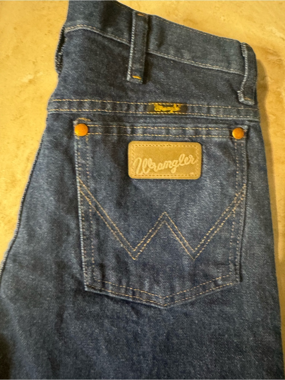 Wrangler Blue Relaxed Fit Men's Jeans with Tan Patch